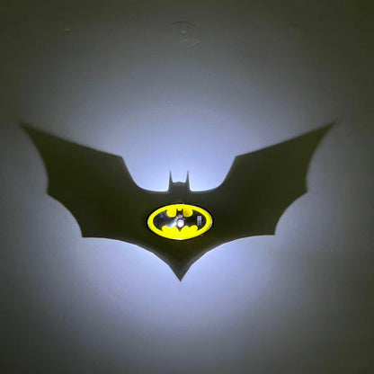 3D-printed Batman shadow lamp product showcase with yellow and black Bat logo.