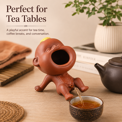 Funny tea fountain tea pet used as playful tea table decor for tea time, coffee breaks, and home drink serving