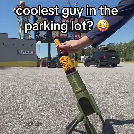 Mortar bottle opener launching a cap from a 330ml beer bottle