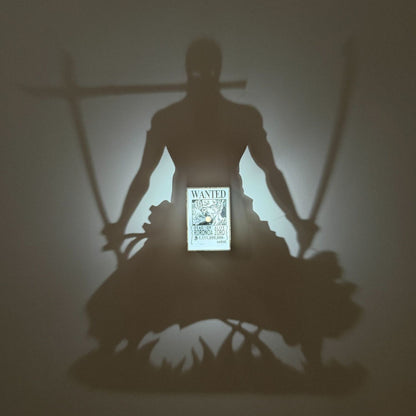 High-quality product image of a custom 3D printed light switch plate designed as Roronoa Zoro's bounty poster. The switch is the central focal point, surrounded by realistic One Piece memorabilia, including the Marine flag and golden coins.